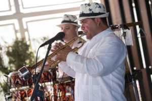 The Cuban Latin Band horn players performing traditional Cuban music